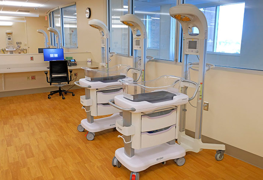 A row of bassinets in the newborn nursery. 